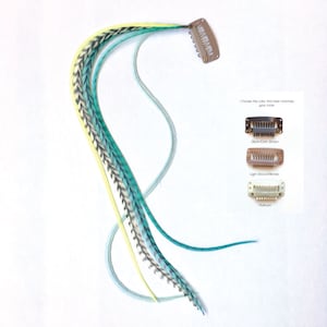 May include: A set of three feather hair extensions in shades of teal, light blue, and yellow. The extensions are attached to a clip that can be used to attach them to hair. The clip is available in three colours: black/dark brown, light brown/blonde, and platinum.