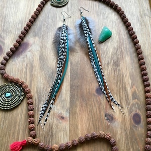 Feather earrings in natural, grizzly and teal colours for a luxurious boho statement look.