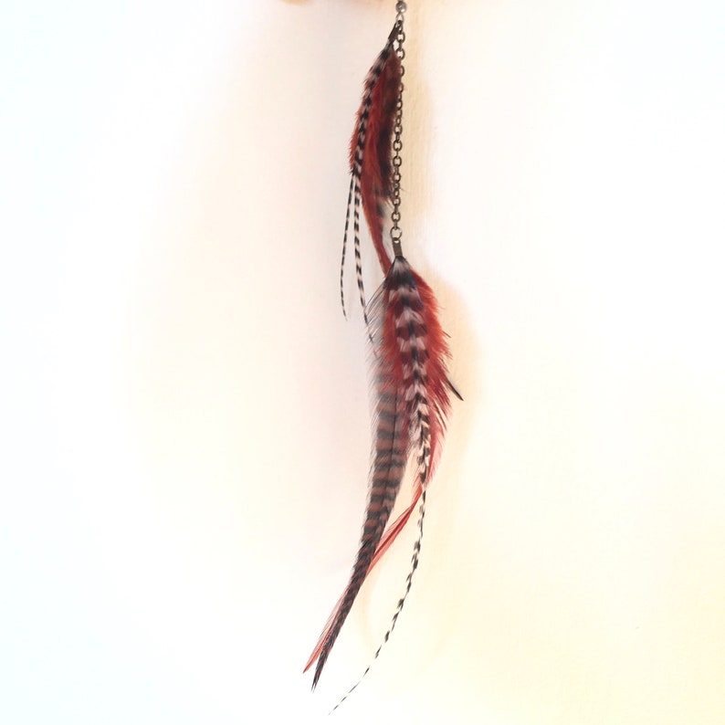 Single long cascading feather earring in burnt orange, rust, black and white stripes. Boho statement, hypoallergenic, handmade, unique. image 5