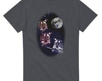 May include: Dark gray t-shirt featuring a graphic of three Daleks, a moon, and a blue police box. The Daleks are in shades of red, silver, and black. The moon is white and gray. The design is centered on the shirt.