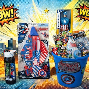 May include: A collection of Captain America and Avengers themed merchandise. Includes a water bottle, a foam glider, a Captain America figure, and a blue bucket filled with toys, all against a comic book style background with "POW!" and "WOW!" text.