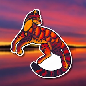 May include: A sticker featuring a stylized illustration of a leopard-like cat in shades of orange, red, and black. The cat is depicted in a crouching pose with its tail curled. The background is a gradient of sunset colors.