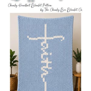 May include: A light blue, chunky hand-knit blanket with a white cross and the word "Faith" vertically displayed. The blanket is made from thick yarn and is draped over a surface. The text "Wrapped in Faith" is at the top.