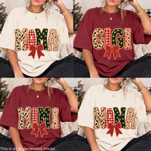 May include: A collection of four short-sleeve t-shirts in cream and maroon colours. Each shirt features a large, festive applique-style graphic on the front with the words MAMA, GIGI, MIMI, or NANA, decorated with red bows and holiday patterns.
