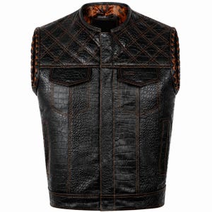 May include: A black sleeveless vest featuring a textured crocodile skin pattern and brown contrast stitching. The upper chest area has a diamond-quilted design, while the interior lining displays a brown and black paisley pattern.