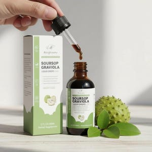 May include: A brown glass bottle and a box of Soursop Graviola Liquid Drops. A dropper dispenses the liquid into the bottle. The box and bottle have green and white labels. A soursop fruit and leaves are also in the image.