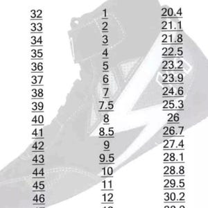 May include: Black and white high-top sneaker with a lightning bolt design. The image includes a size chart with US, Euro, and centimeter measurements. Sizes range from US size 1 (20.4 cm) to US size 14 (31.8 cm).