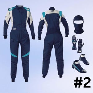 May include: A navy blue racing suit with white and teal accents, displayed with a matching balaclava, gloves, and racing boots. The suit features the "OMP" logo and is designed for motorsports. The number "#2" is visible in the bottom right corner.