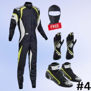 May include: A black and white racing suit with yellow accents, a black balaclava, black gloves, and black racing shoes. The balaclava has a red "FREE" tag. The shoes and gloves have the "OMP" logo.