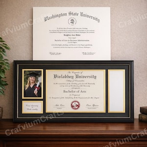 May include: A black framed diploma display featuring a photo, a diploma, and a small plaque with the text "Keep dreaming, make reality." The diploma is for a Bachelor of Arts degree from Violabbey University.