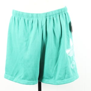 May include: Teal athletic shorts with a white Adidas logo on the right leg.