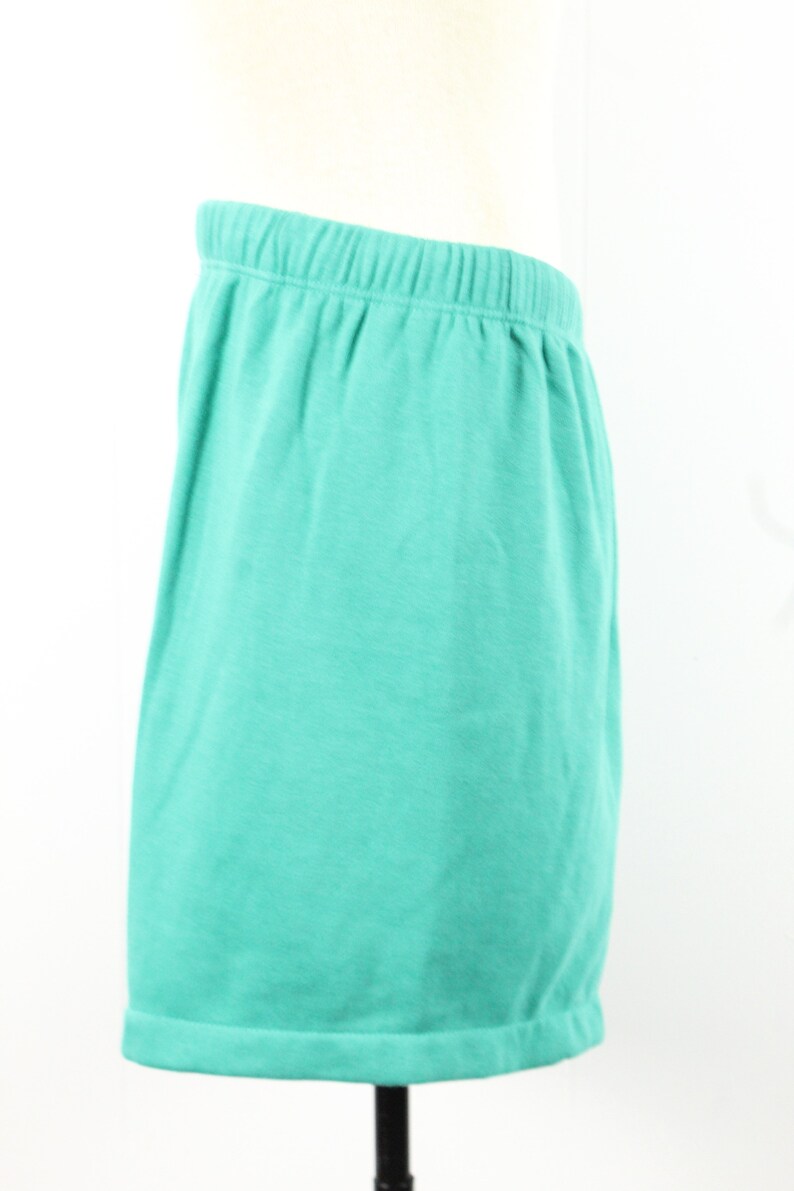 May include: A pair of teal blue shorts with an elastic waistband.
