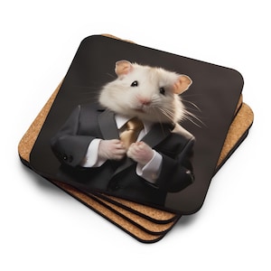 May include: A set of square coasters with a humorous image of a hamster wearing a black suit, white shirt, and gold tie. The coasters have a cork backing and a glossy image surface. The hamster is the focal point, appearing to adjust its suit.