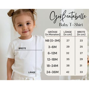May include: A young child wearing a white t-shirt, with a size chart labeled "Baby T-Shirt" in German. The chart shows measurements in centimeters for length and width, with sizes ranging from newborn to 24-36 months.
