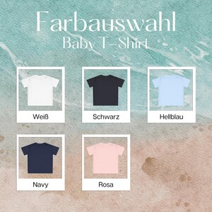 May include: A selection of baby t-shirts in white, black, light blue, navy, and pink. The image includes the text "Farbauswahl Baby T-Shirt" in a stylized font, showcasing the available color options.