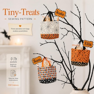 May include: A sewing pattern titled Tiny-Treats featuring three mini fabric bags with Halloween-themed prints including spiderwebs, stars, and diamonds. The bags are displayed hanging from a black decorative branch with name tags labeled Kate, Ella, and Sam.