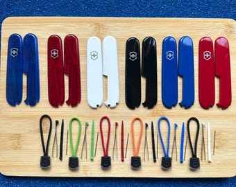 Juego de escalas Victorinox "PLUS" de 91 mm con pinzas, palillo, cordón y alfiler (ranura para bolígrafo)