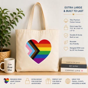 May include: A natural-colored cotton canvas tote bag featuring a large Progress Pride heart graphic on the front. The bag measures 17.5 inches wide by 16.5 inches high by 5 inches deep and is made from 10oz premium cotton canvas material.