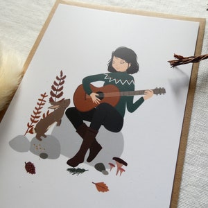 Carte postale "Un air de guitare", série "Un lapin à la maison"