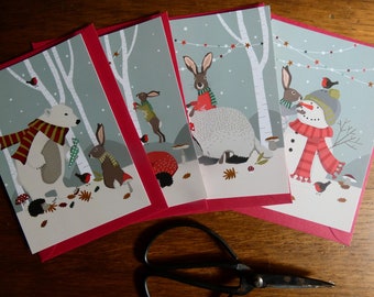 Lot de 4 cartes postales Noël en forêt.