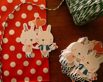 Etiquettes cadeau Saint Valentin. Deux lapins amoureux parfaits pour embellir vos emballages cadeaux pour la fête des amoureux.