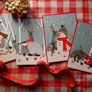 Lot de 4 cartes postales Noël en forêt.