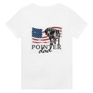 May include: White t-shirt featuring a graphic of a Pointer dog with an American flag design. The text "POINTER dad" is printed below the dog and flag. The design is in shades of black, white, red, and blue.