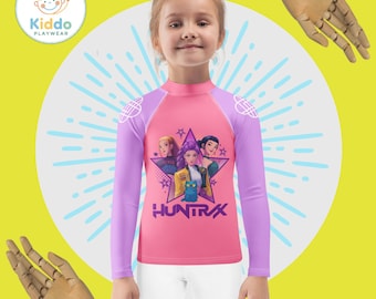 Camiseta de natación infantil con protección UV - Estilo K-Pop, manga larga, color rosa y morado pastel.