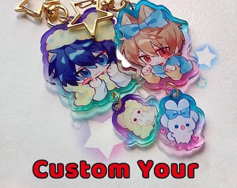 Op de afbeelding: Een verzameling kleurrijke acryl sleutelhangers met anime-achtige karakters, met gouden ster- en ronde sleutelringen. De sleutelhangers hebben een gradiëntontwerp met de tekst "Custom Your Own Keychains" in het rood.