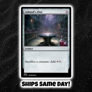 May include: A rectangular trading card titled Ashnod's Altar with a cost of 3, featuring an illustration of a dark stone table in a dimly lit room with red vials. The card text reads Artifact and Sacrifice a creature: Add two colorless mana.