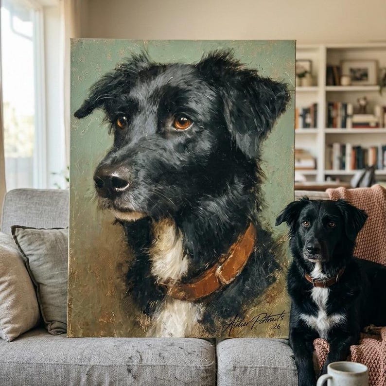 May include: A painted portrait of a black dog with brown eyes and a brown collar. The painting is on a canvas with a green background. A real black dog with a brown collar is sitting next to the painting.
