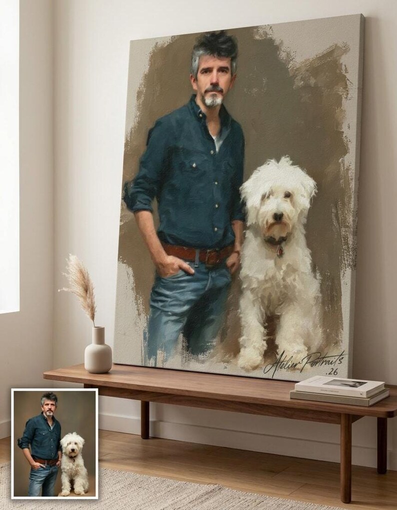 May include: Oil painting portrait of a man and a white dog. The man is wearing a blue shirt and jeans. The dog is fluffy. The painting is signed "Atelier Portraits .26". The painting is displayed on a wooden bench.