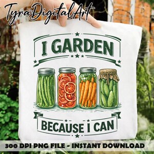 May include: White tote bag with the text "I GARDEN BECAUSE I CAN" and illustrations of jars filled with vegetables. The jars contain asparagus, sliced tomatoes, carrots, and pickles. The bag is held by a person.