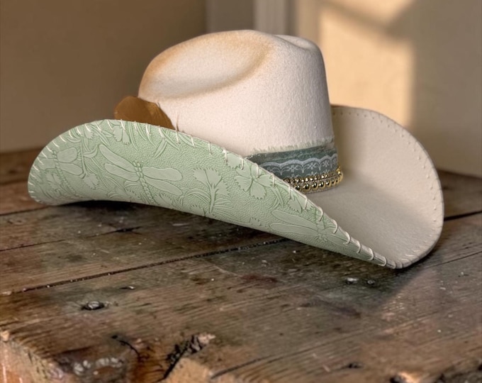 100% wool ivory cowboy hat with mint leather handstitched to brim.