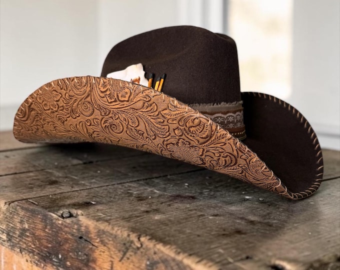 100% wool brown cowboy hat with brown tooled leather handstitched to brim