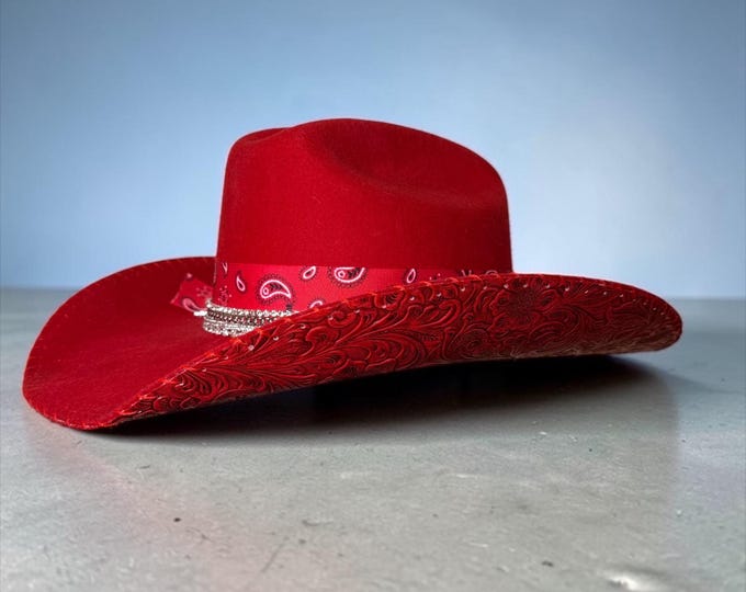 100% wool red cowboy hat with red tooled leather handstitched to brim