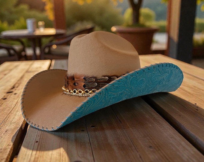 100% wool tan cowboy hat with teal tooled leather handstitched to brim