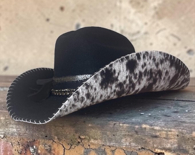 100% wool black cowboy hat with cow print fabric handstitched to brim