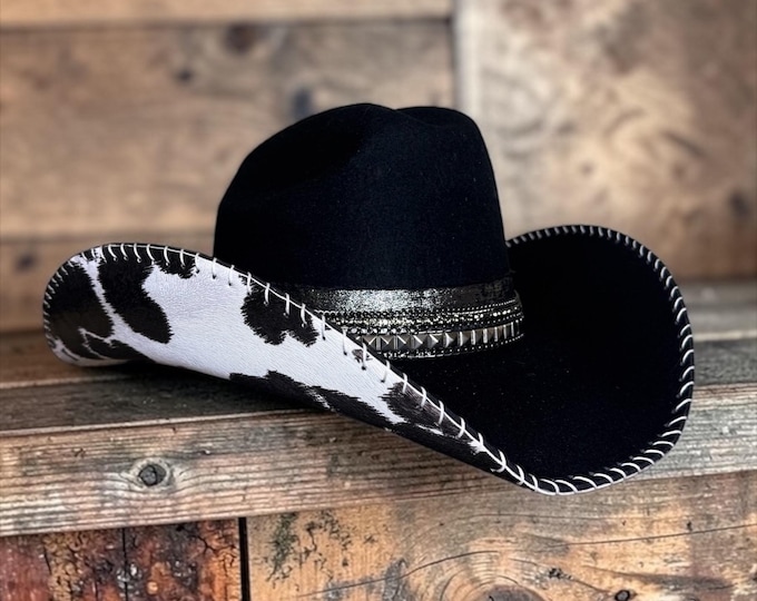 100% wool black cowboy hat with cow print leather handstitched to brim