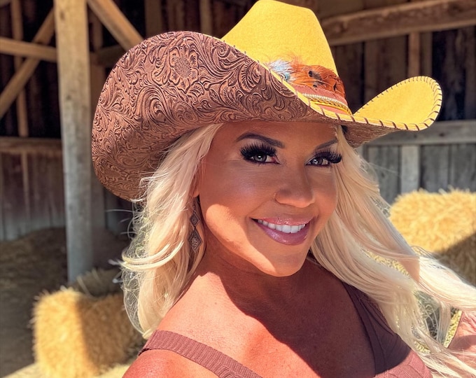 100% wool mustard cowboy hat with brown tooled leather handstitched to brim