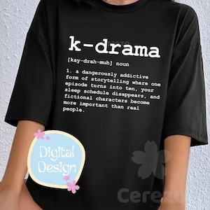 May include: Black t-shirt with the word "k-drama" in white, along with a definition. The definition describes a dangerously addictive form of storytelling. A "Digital Design" logo is on the shirt.