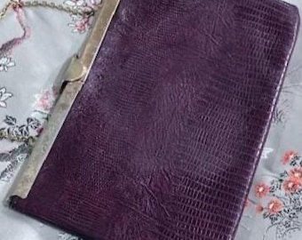 1960s Etra burgundy lizard leather clutch with bird clasp, metal frame, and chain strap