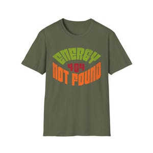 May include: An olive green t-shirt featuring the text "ENERGY 404 NOT FOUND" in distressed orange, green, and red lettering. The graphic is centered on the front of the short-sleeved shirt.