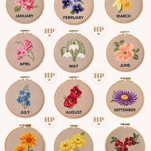 May include: A collection of twelve cross-stitch floral designs, each in a wooden embroidery hoop. Each hoop features a different flower and the month's name: January, February, March, April, May, June, July, August, September, October, November, and December.