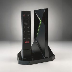 May include: A white ceramic mug with a black handle and the text "But First, Coffee" in a black, handwritten-style font. The mug is on a white surface.