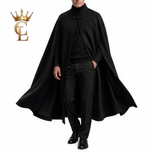 May include: A floor-length black cape featuring a high collar and a front button closure. The garment is worn over a black long-sleeve shirt and black trousers. A gold crown logo with the letters CL is positioned in the upper left corner.