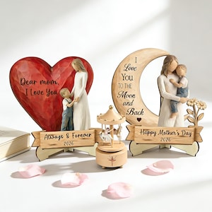 May include: Two decorative figurines for Mother's Day. One features a red heart with the text "Dear mom, I Love You." The other is a crescent moon with the text "I Love You to the Moon and Back." Both have figures of a mother and child.