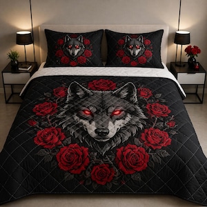 May include: Black comforter and pillow set featuring a wolf with glowing red eyes surrounded by red roses. The bedding has a quilted pattern. The pillows and comforter have a matching design.