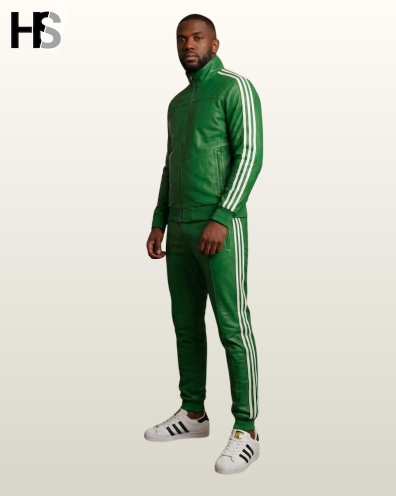 May include: A vibrant green leather tracksuit featuring a full-zip jacket with a high collar and matching slim-fit trousers. Both pieces are adorned with three white vertical stripes running down the sleeves and the outer legs. White sneakers.