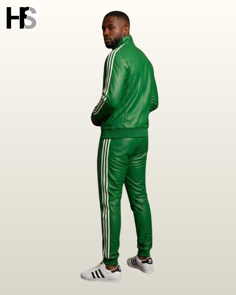May include: A vibrant green leather tracksuit featuring a high-neck zip-up jacket and matching trousers. Both pieces are adorned with three white vertical stripes running down the sleeves and legs. The outfit is paired with white sneakers.